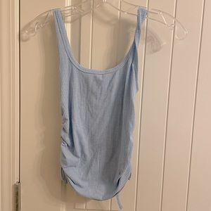 Tank with tied sides